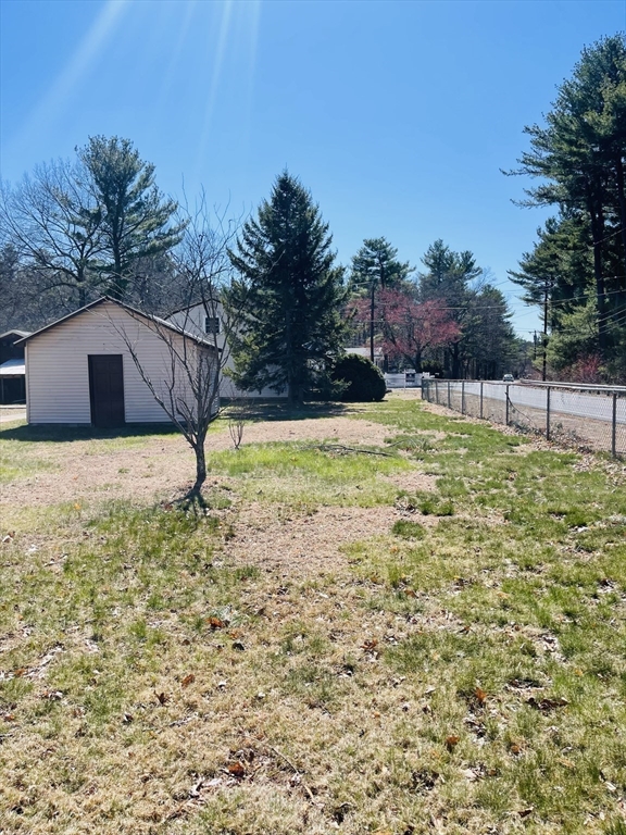 75 Frost Road Tyngsboro, MA 01879 - Photo 5 of 15 a swimming pool with trees in the background