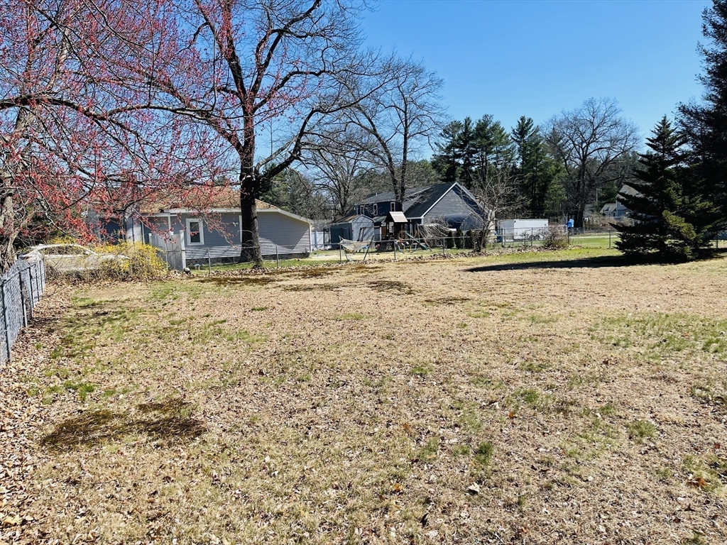 75 Frost Road Tyngsboro, MA 01879 - Photo 6 of 15 a front view of a house with a yard