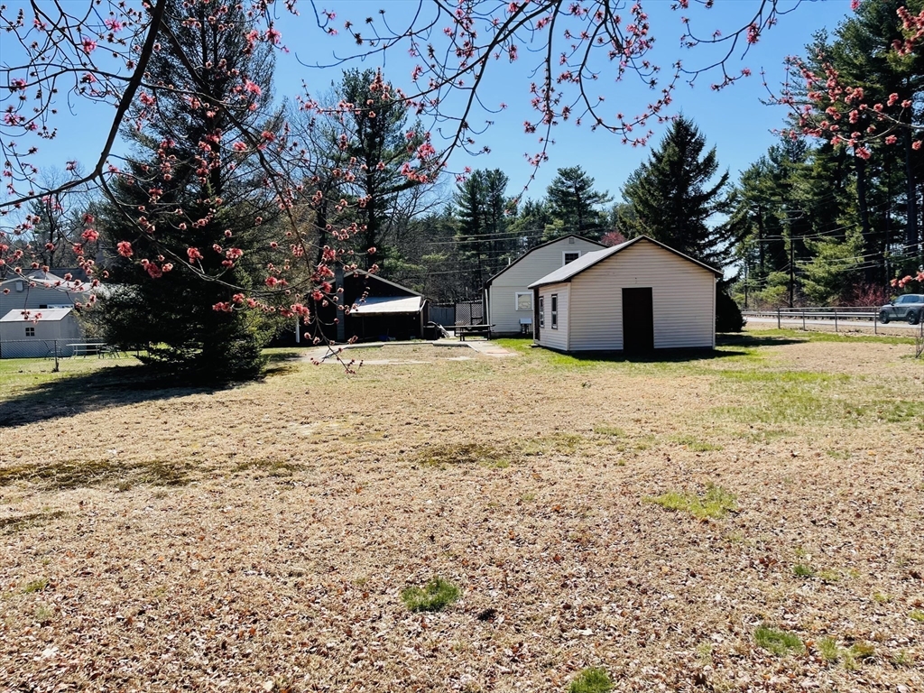 75 Frost Road Tyngsboro, MA 01879 - Photo 7 of 15 a view of a house with a yard
