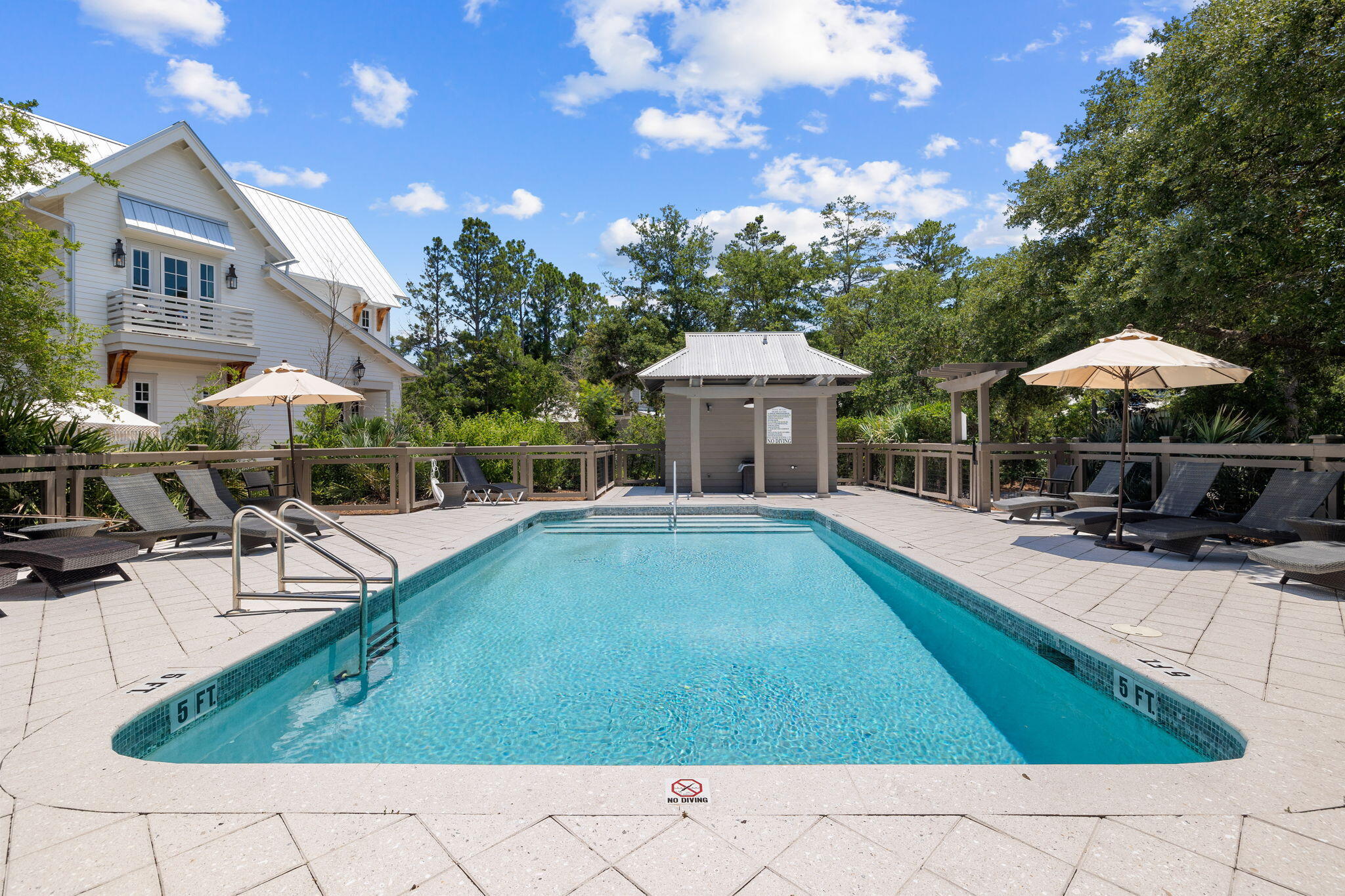 42 Bosk Lane Santa Rosa Beach, FL 32459 - Photo 11 of 13 a view of a patio with chairs and tables