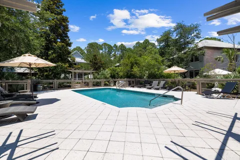 a view of a patio with chairs and tables