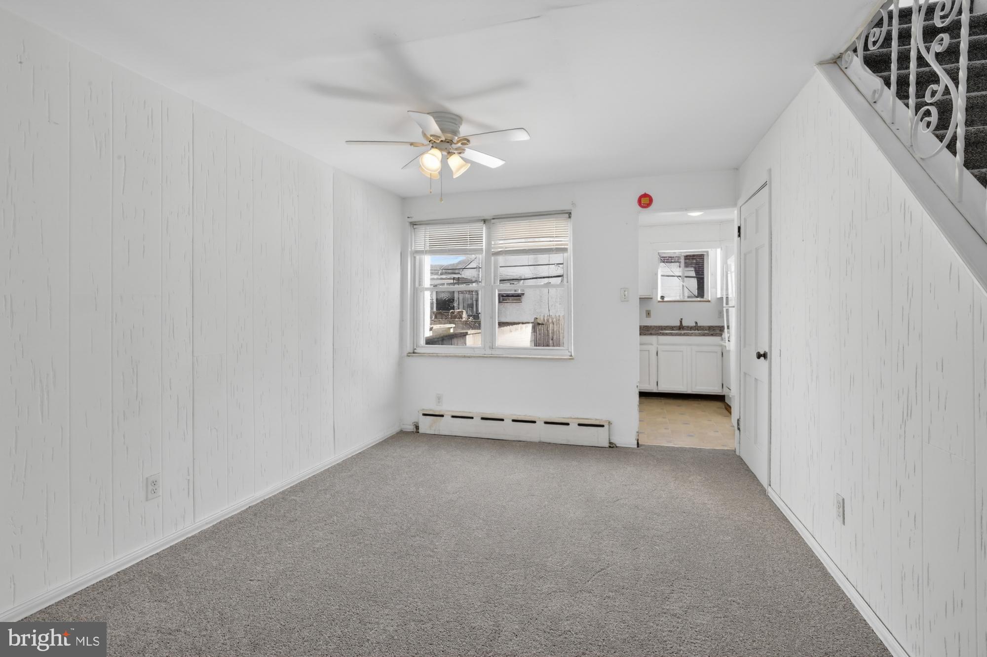 1617 South Newkirk Street Philadelphia, PA 19145 - Photo 4 of 22 an empty room with windows and fan