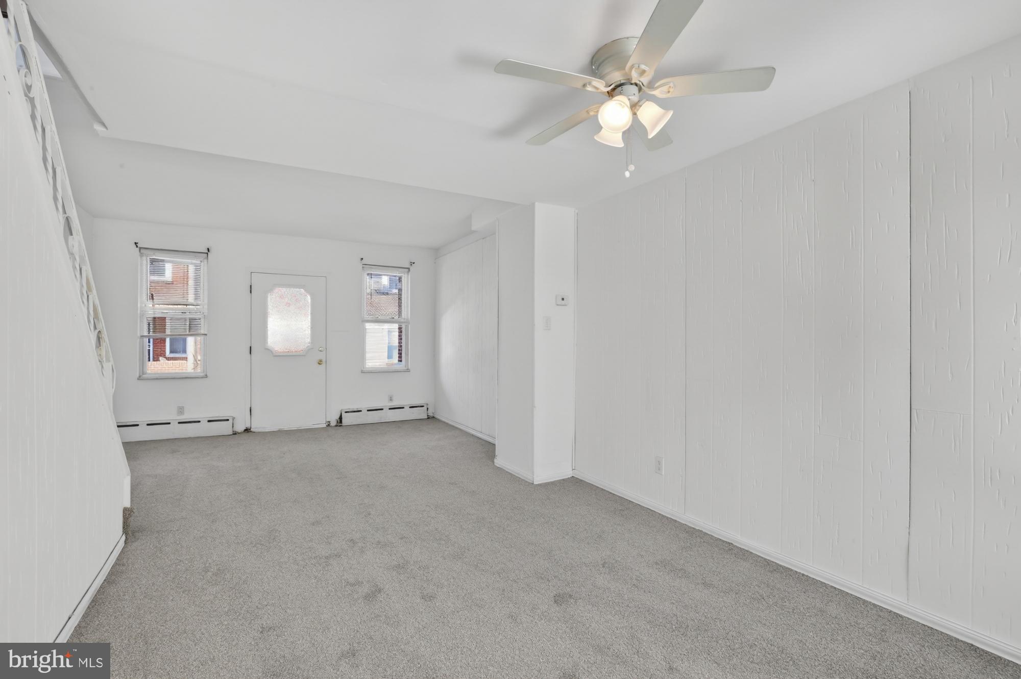 1617 South Newkirk Street Philadelphia, PA 19145 - Photo 6 of 22 an empty room with windows and fan