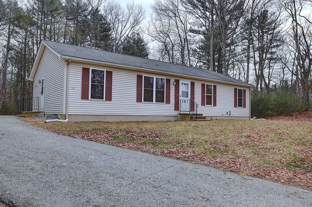 218 New Boston Road Sturbridge, MA 01566 - Photo 1 of 23 a view of a house with a yard