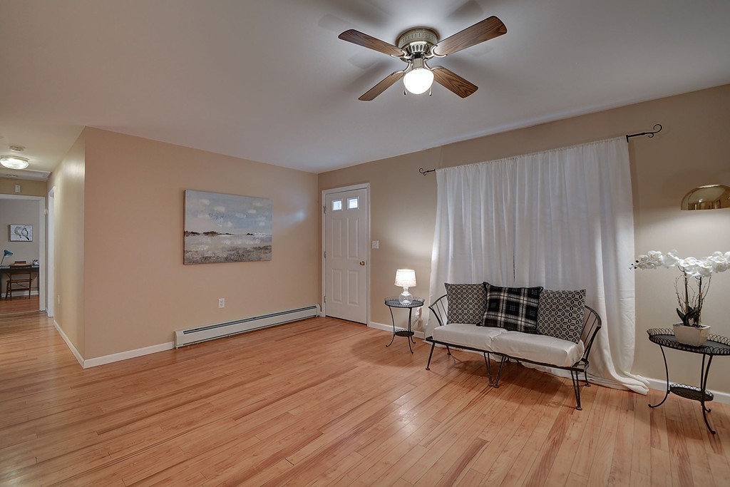 218 New Boston Road Sturbridge, MA 01566 - Photo 11 of 23 a living room with furniture and wooden floor