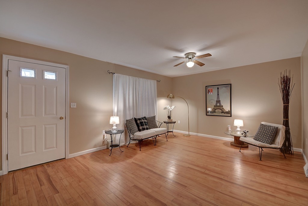 218 New Boston Road Sturbridge, MA 01566 - Photo 12 of 23 a living room with furniture and a wooden floor