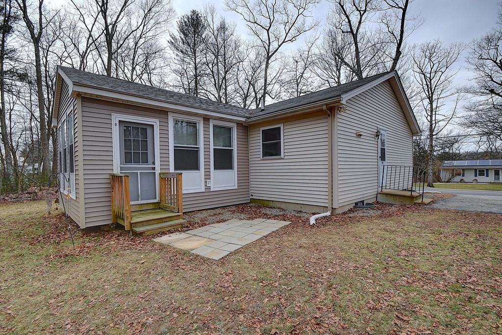 218 New Boston Road Sturbridge, MA 01566 - Photo 21 of 23 a view of house with a yard and large tree