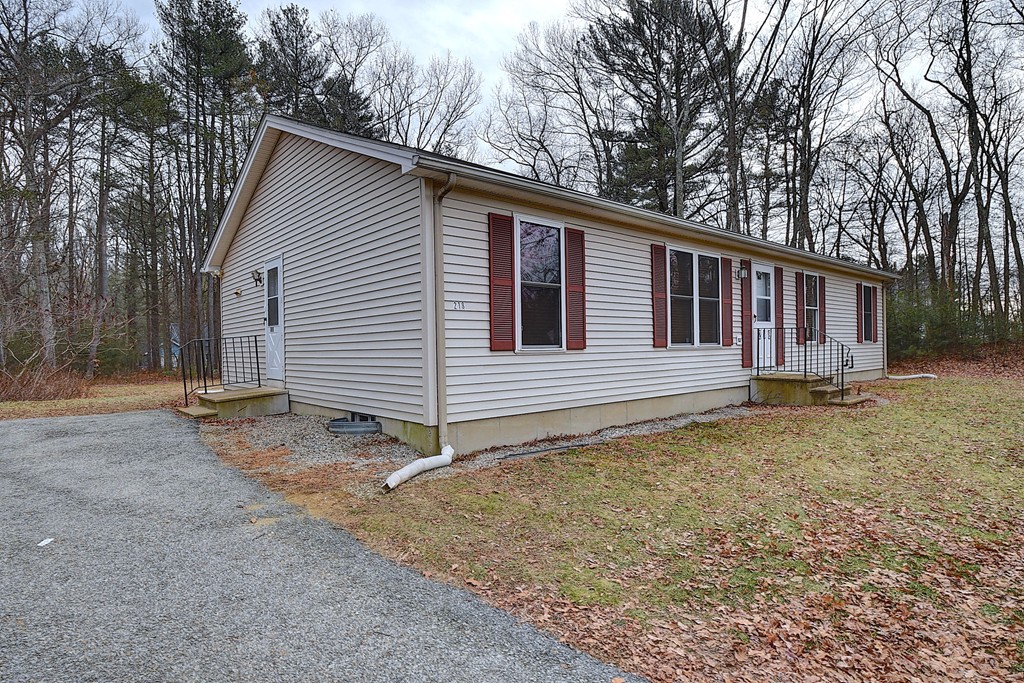 218 New Boston Road Sturbridge, MA 01566 - Photo 3 of 23 a house with trees in the background