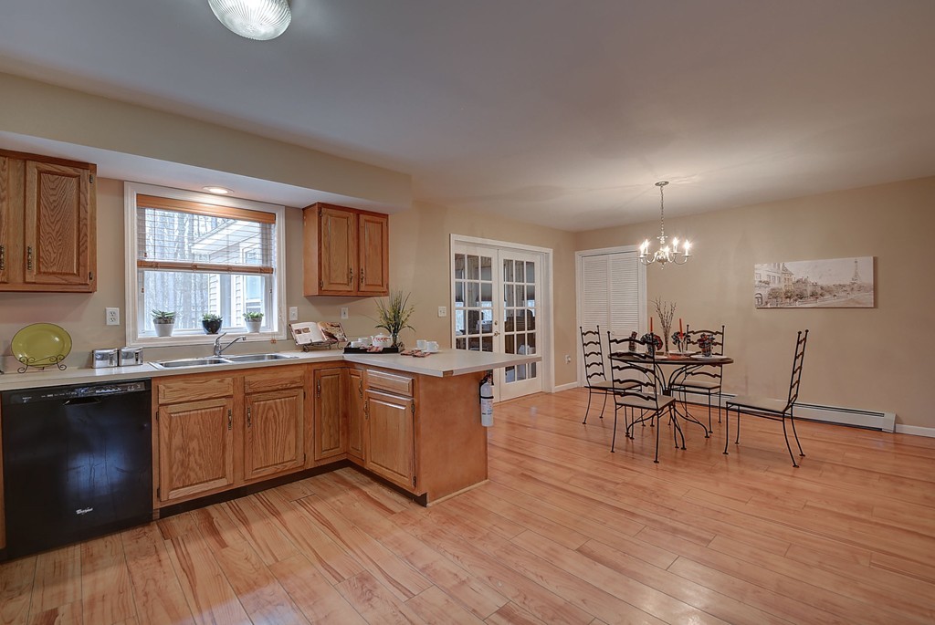 218 New Boston Road Sturbridge, MA 01566 - Photo 4 of 23 a kitchen with cabinets table and chairs