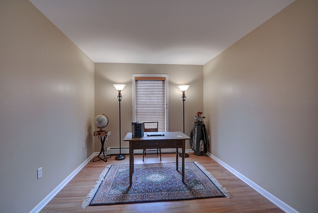218 New Boston Road Sturbridge, MA 01566 - Photo 6 of 23 a view of a livingroom with furniture and wooden floor