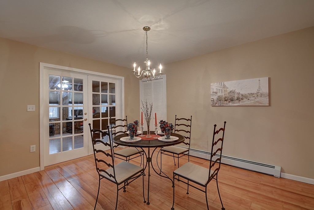 218 New Boston Road Sturbridge, MA 01566 - Photo 9 of 23 a view of a dining room with furniture wooden floor and chandelier