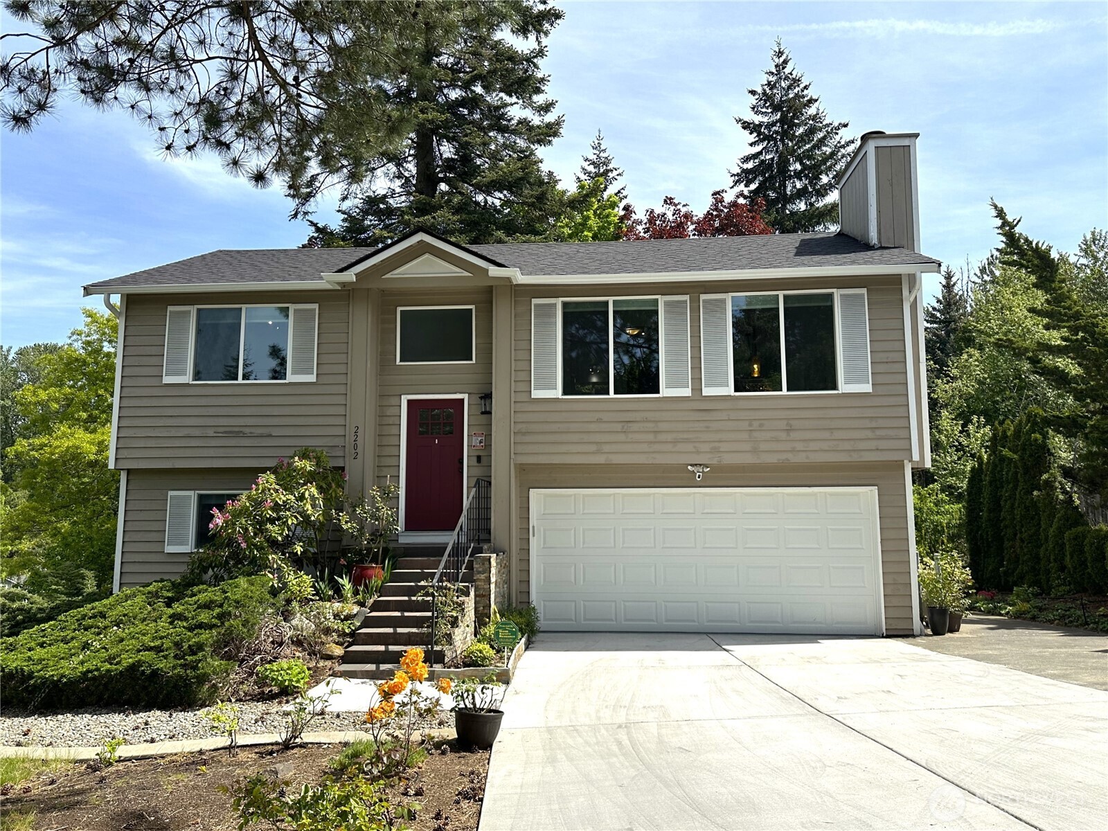 2202 Wells Court South Renton, WA 98055 - Photo 1 of 1 a front view of a house with a yard and garage