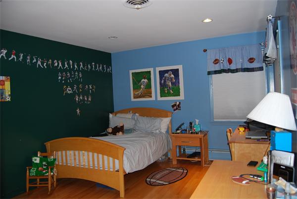 14 Sheldon Road Marblehead, MA 01945 - Photo 8 of 19 a bedroom with a bed and a table in it
