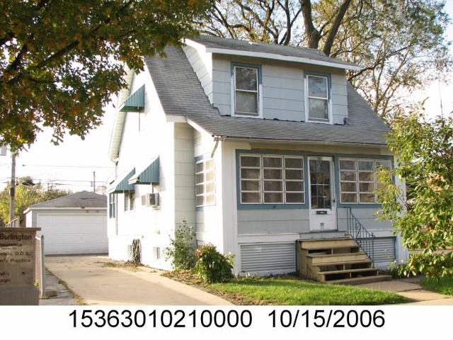 99 East Burlington Street Riverside, IL 60546 - Photo 1 of 1 a front view of a house with a garden