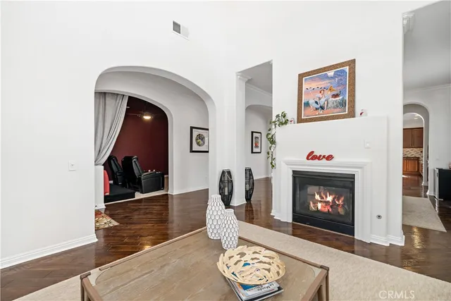 a living room with furniture fireplace and window