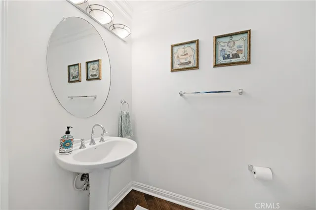 a kitchen with stainless steel appliances granite countertop a stove top oven a refrigerator a sink and dishwasher with wooden floor