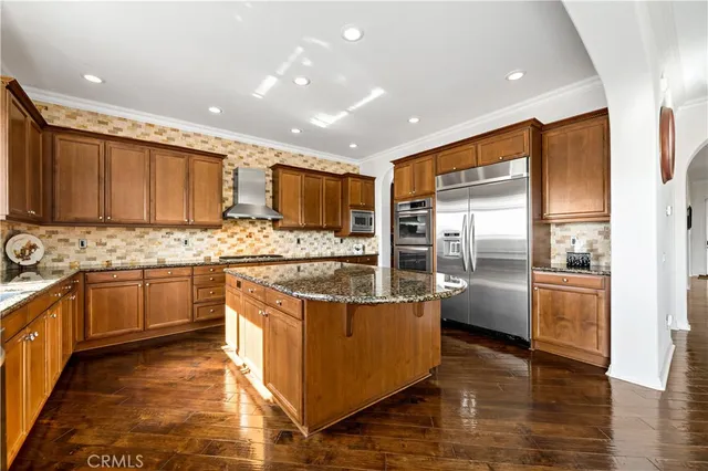 a view of a livingroom with furniture window and wooden floor