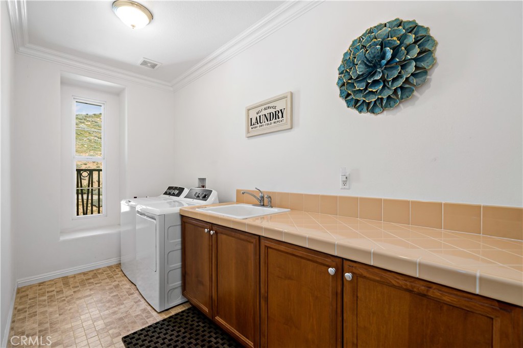 16423 Village Meadow Drive Riverside, CA 92503 - Photo 39 of 63 a room with a sink and a window