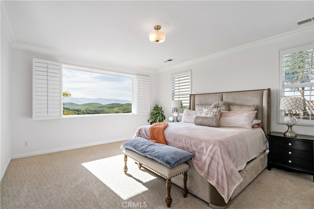 16423 Village Meadow Drive Riverside, CA 92503 - Photo 43 of 63 a bedroom with a bed and window