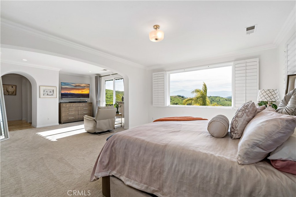 16423 Village Meadow Drive Riverside, CA 92503 - Photo 44 of 63 a bedroom with a bed and window