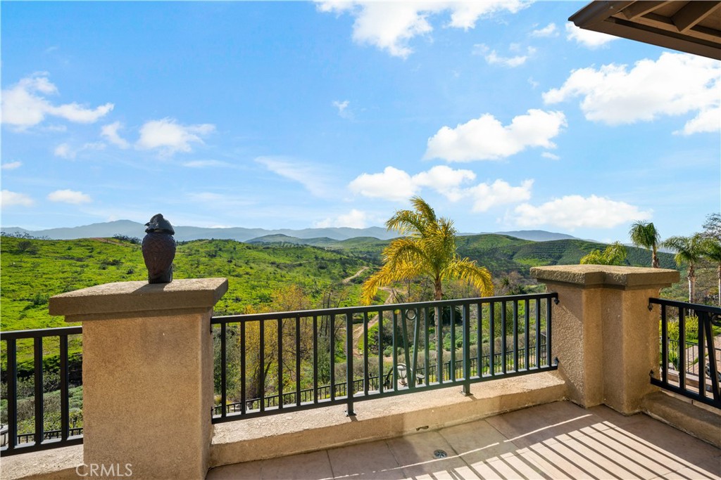 16423 Village Meadow Drive Riverside, CA 92503 - Photo 49 of 63 a view of a balcony with an ocean view