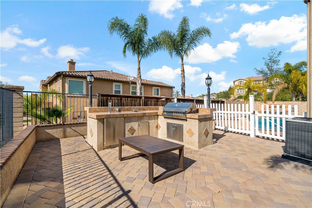 16423 Village Meadow Drive Riverside, CA 92503 - Photo 55 of 63 a view of a chairs and table on the terrace