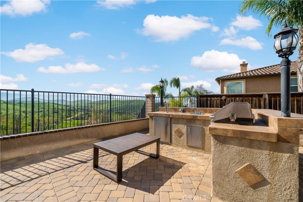 16423 Village Meadow Drive Riverside, CA 92503 - Photo 57 of 63 a view of a terrace with seating area