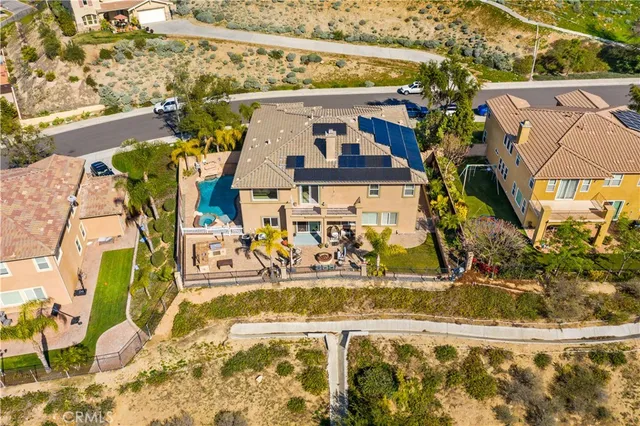 a view of a swimming pool with outdoor seating