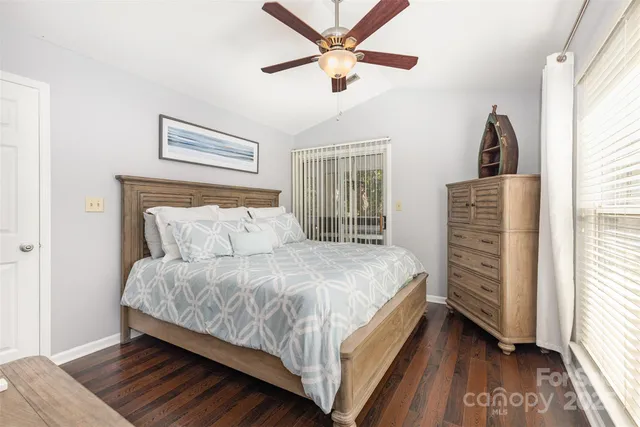 a bed room with a bed and a window