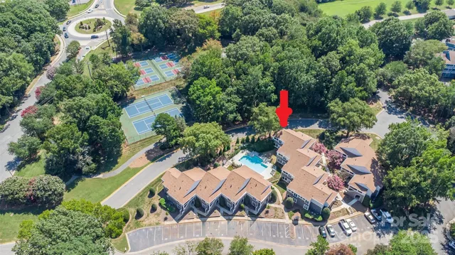 an aerial view of residential house with outdoor space and swimming pool