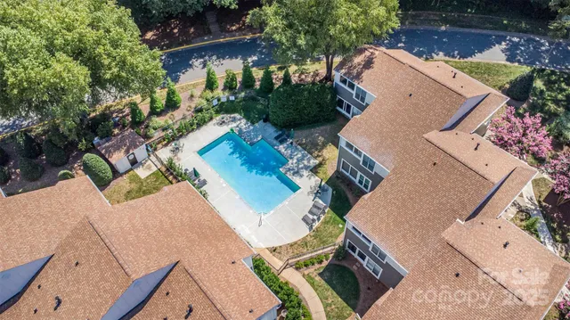an aerial view of a house with outdoor space