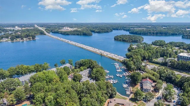an aerial view of a houses with a yard