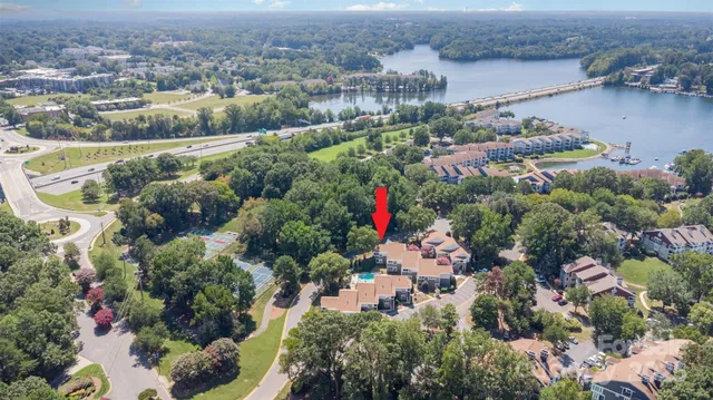 an aerial view of a houses with outdoor space and lake view
