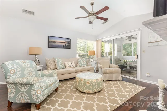 a living room with furniture and a rug