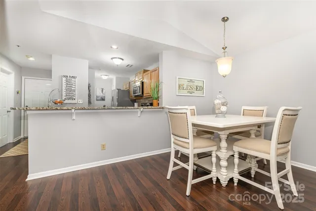 a kitchen with a table and chairs in it