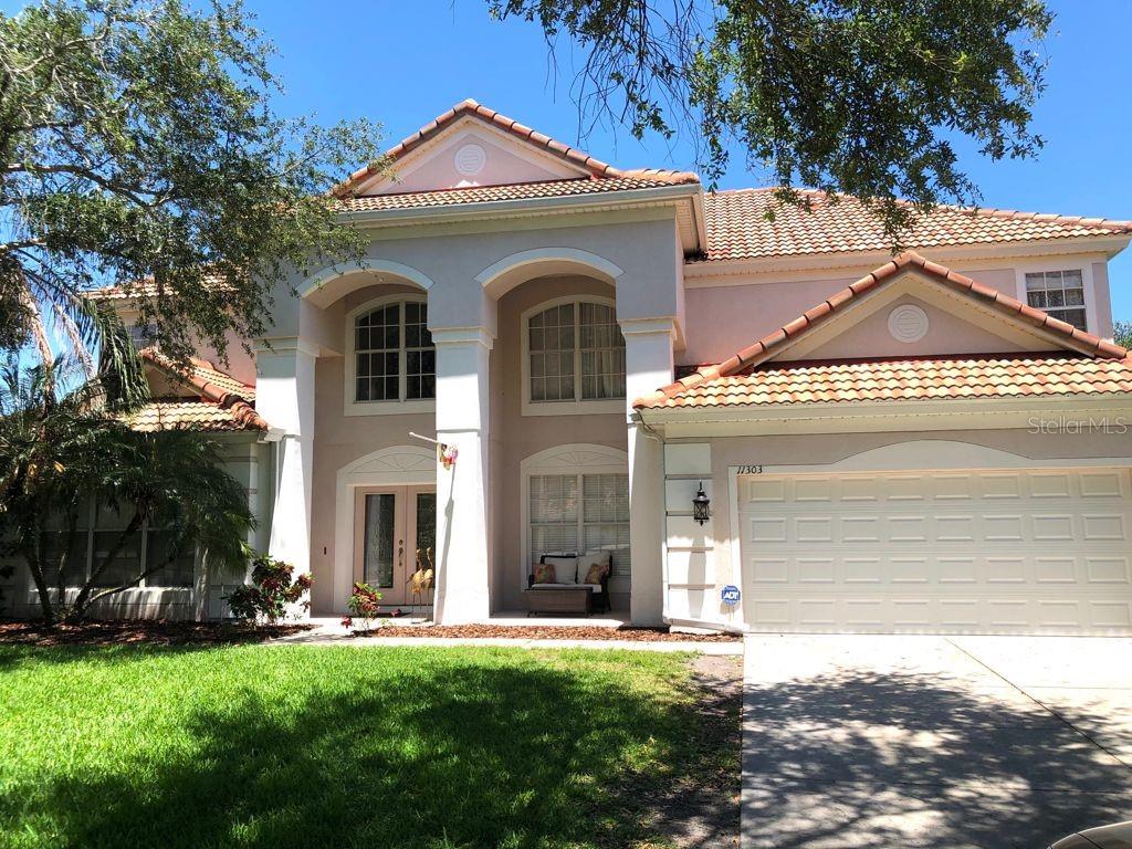 11303 Ledgement Lane Windermere, FL 34786 - Photo 1 of 1 a front view of a house with a garden