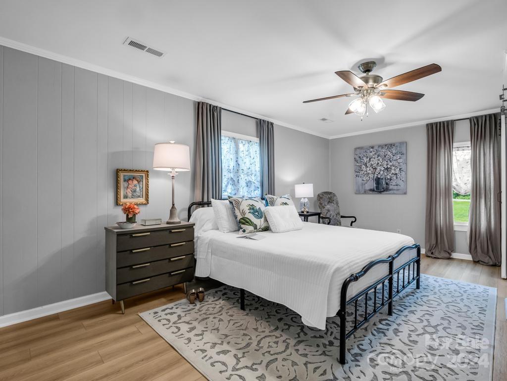 1629 State Line Road Mooresboro, NC 28114 - Photo 24 of 43 a room with a bed and a chandelier