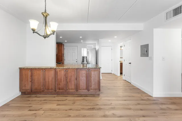 a view of kitchen with wooden floor