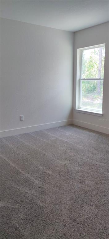 16295 Pomp Parkway Weeki Wachee, FL 34614 - Photo 14 of 28 an empty room with a window