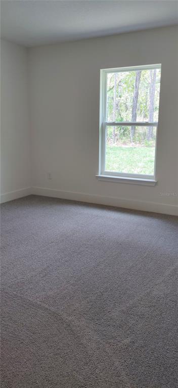 16295 Pomp Parkway Weeki Wachee, FL 34614 - Photo 15 of 28 an empty room with a window