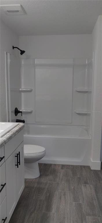 16295 Pomp Parkway Weeki Wachee, FL 34614 - Photo 18 of 28 a bathroom with a toilet a sink and bathtub