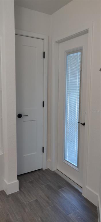16295 Pomp Parkway Weeki Wachee, FL 34614 - Photo 19 of 28 a view of an empty room with wooden floor and closet