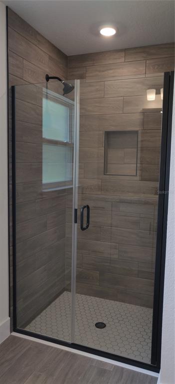 16295 Pomp Parkway Weeki Wachee, FL 34614 - Photo 24 of 28 a bathroom with a shower