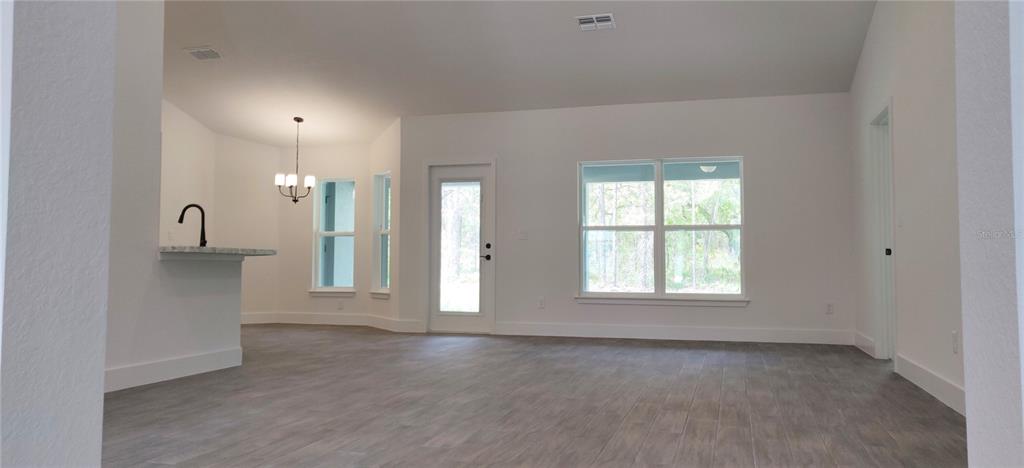 16295 Pomp Parkway Weeki Wachee, FL 34614 - Photo 3 of 28 a view of an empty room with a window