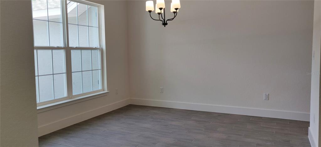 16295 Pomp Parkway Weeki Wachee, FL 34614 - Photo 5 of 28 an empty room with a window