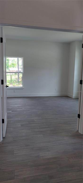 16295 Pomp Parkway Weeki Wachee, FL 34614 - Photo 6 of 28 a view of an empty room and window