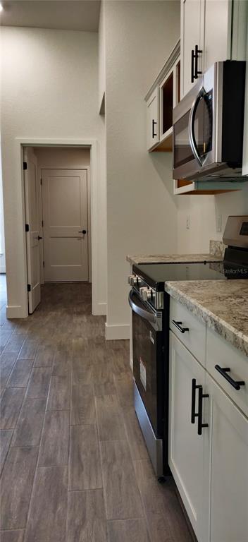 16295 Pomp Parkway Weeki Wachee, FL 34614 - Photo 8 of 28 a kitchen with a stove and a sink