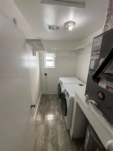 a view of a storage & utility room with washer and dryer