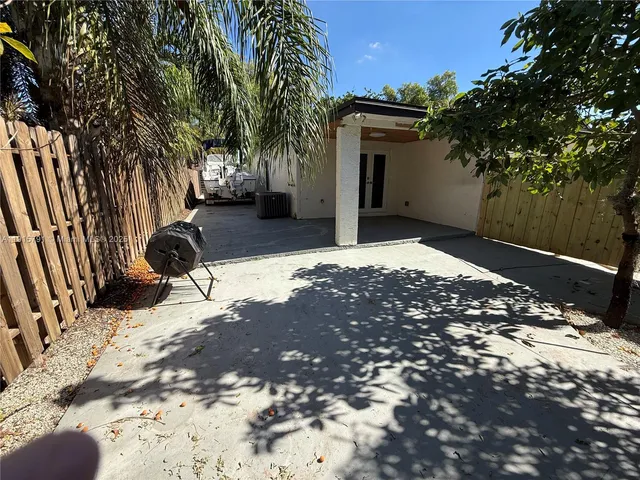 a view of a backyard of the house