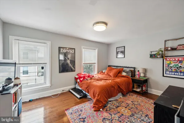 a bedroom with furniture and a window